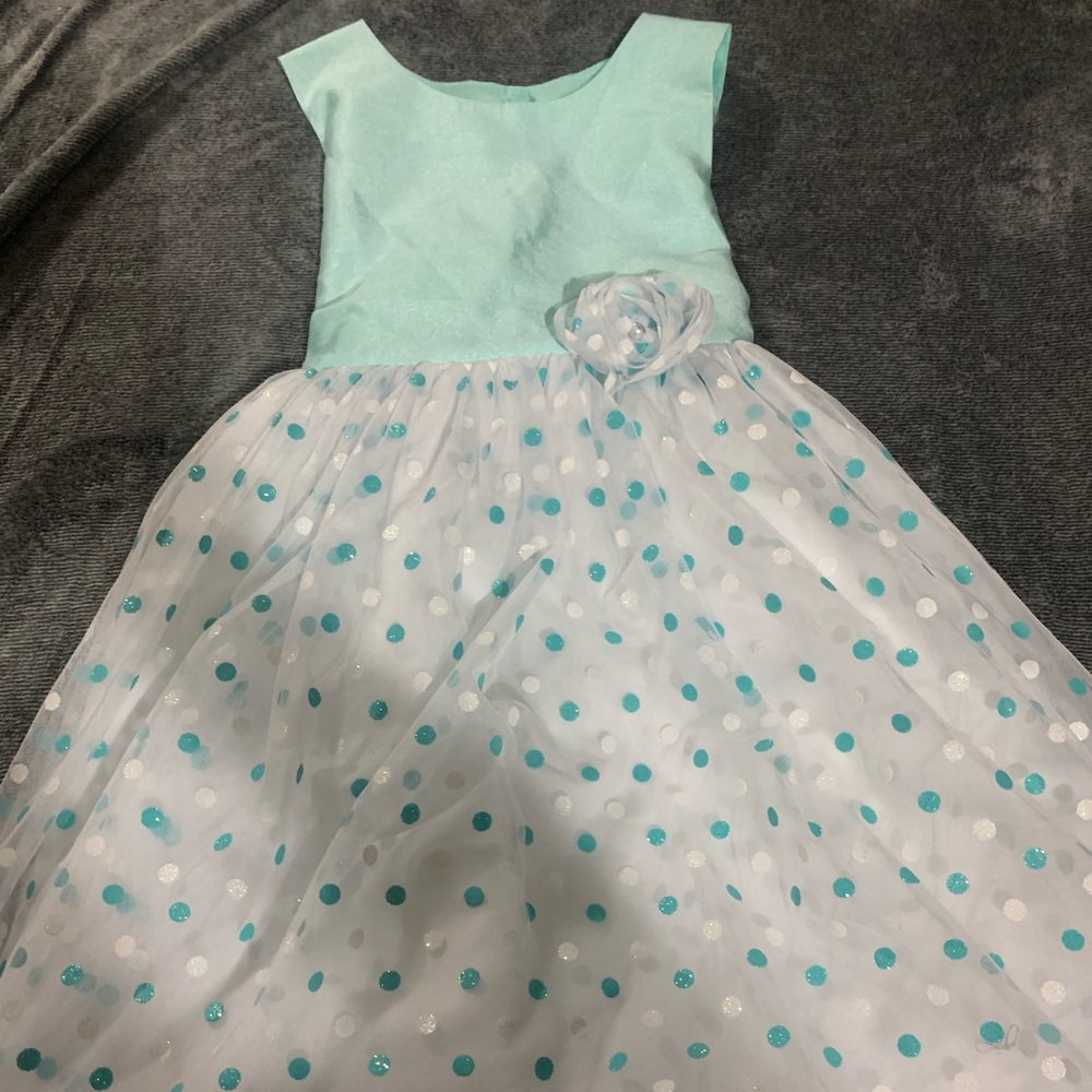 this is a nice pretty teal dress with polka dots.
